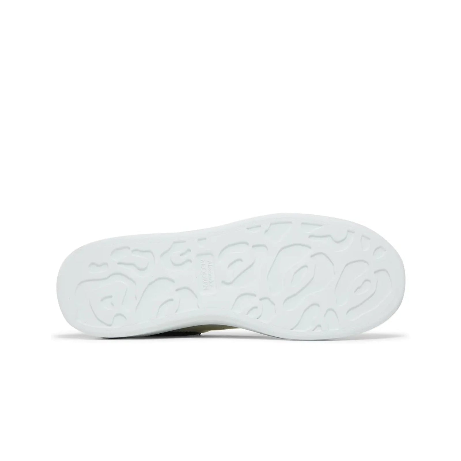 White shoe sole with tread pattern on a white background