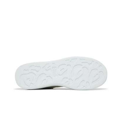White shoe sole with tread pattern on a white background