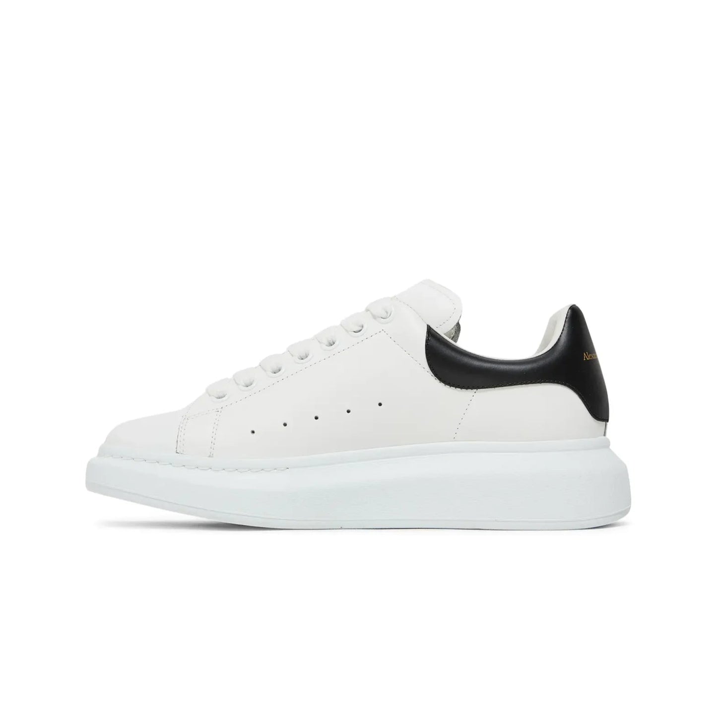 White sneaker with black heel on a white background