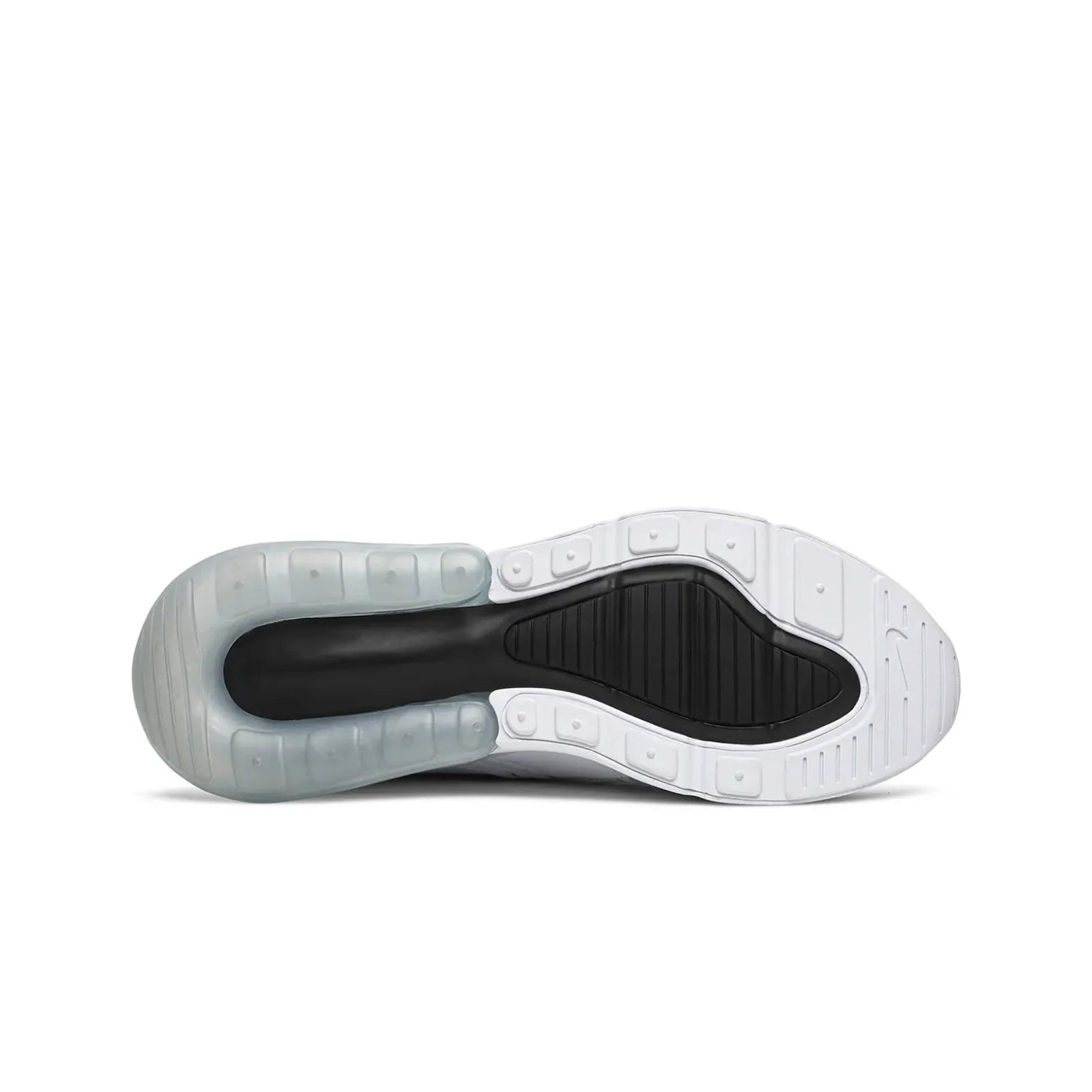 Sole of a white sneaker with black interior on a white background