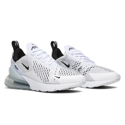 White Nike sneakers with black accents on a white background