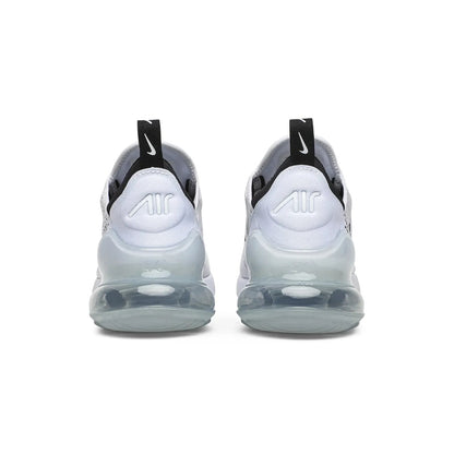 White sneakers with black accents on a white background