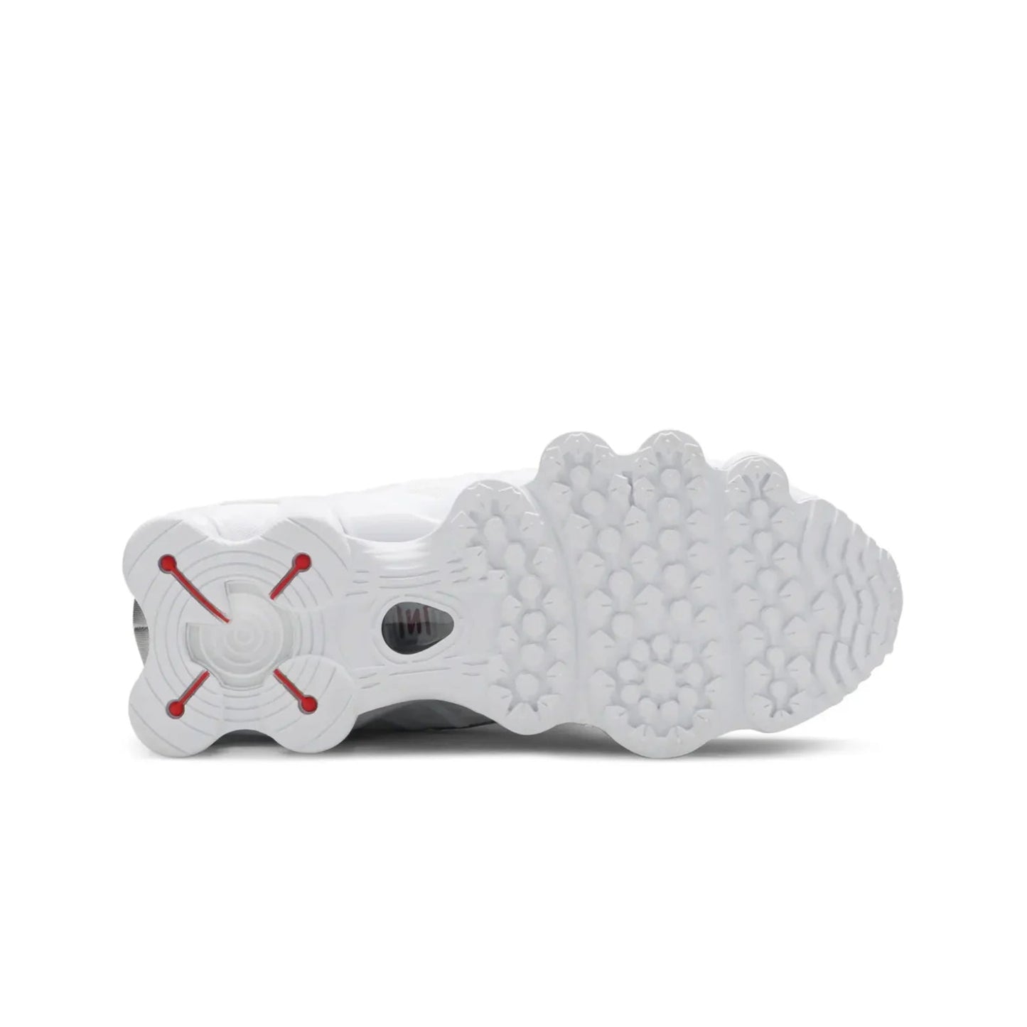 White sneaker sole with red accents on a white background