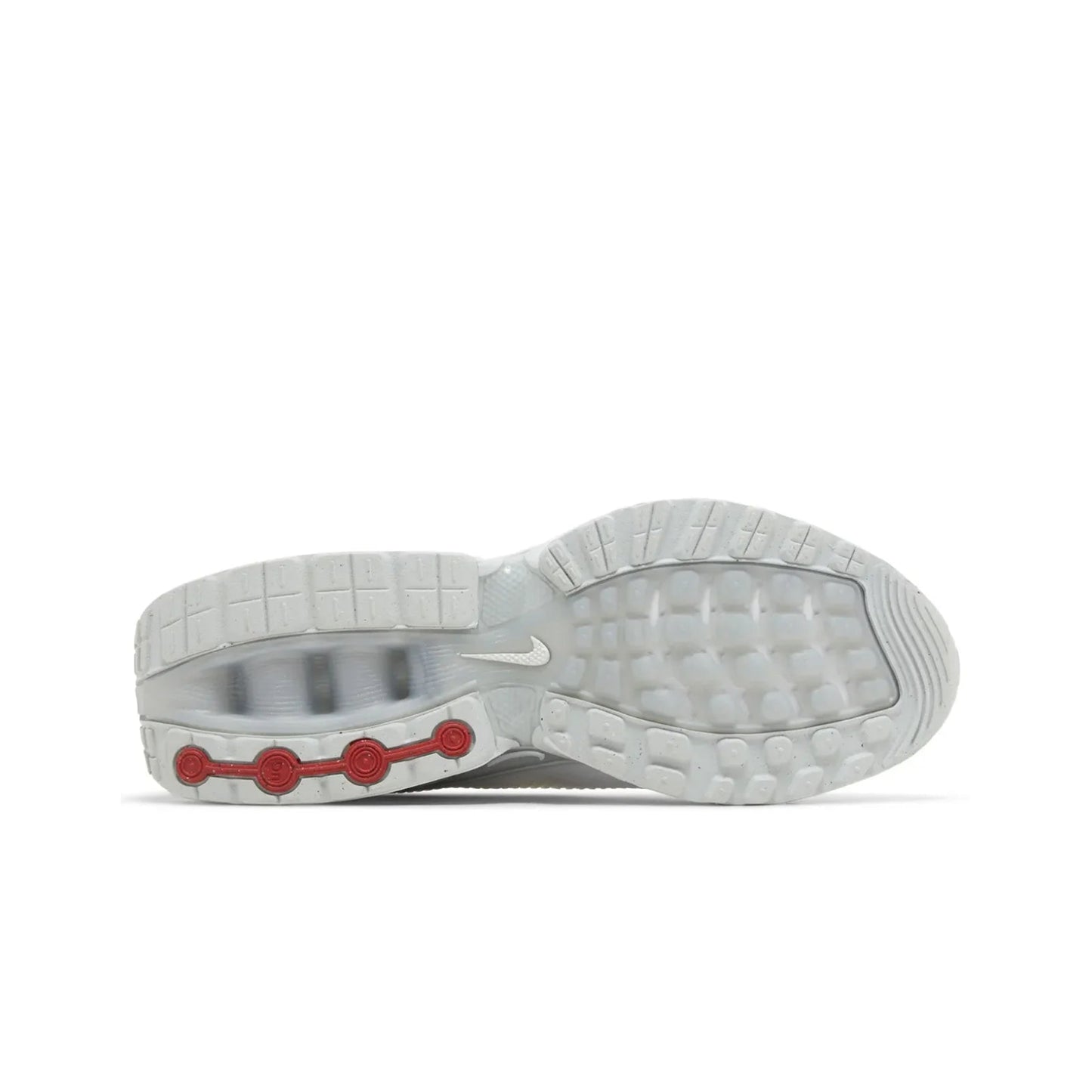 Close-up of a gray athletic shoe sole with red accents on a white background