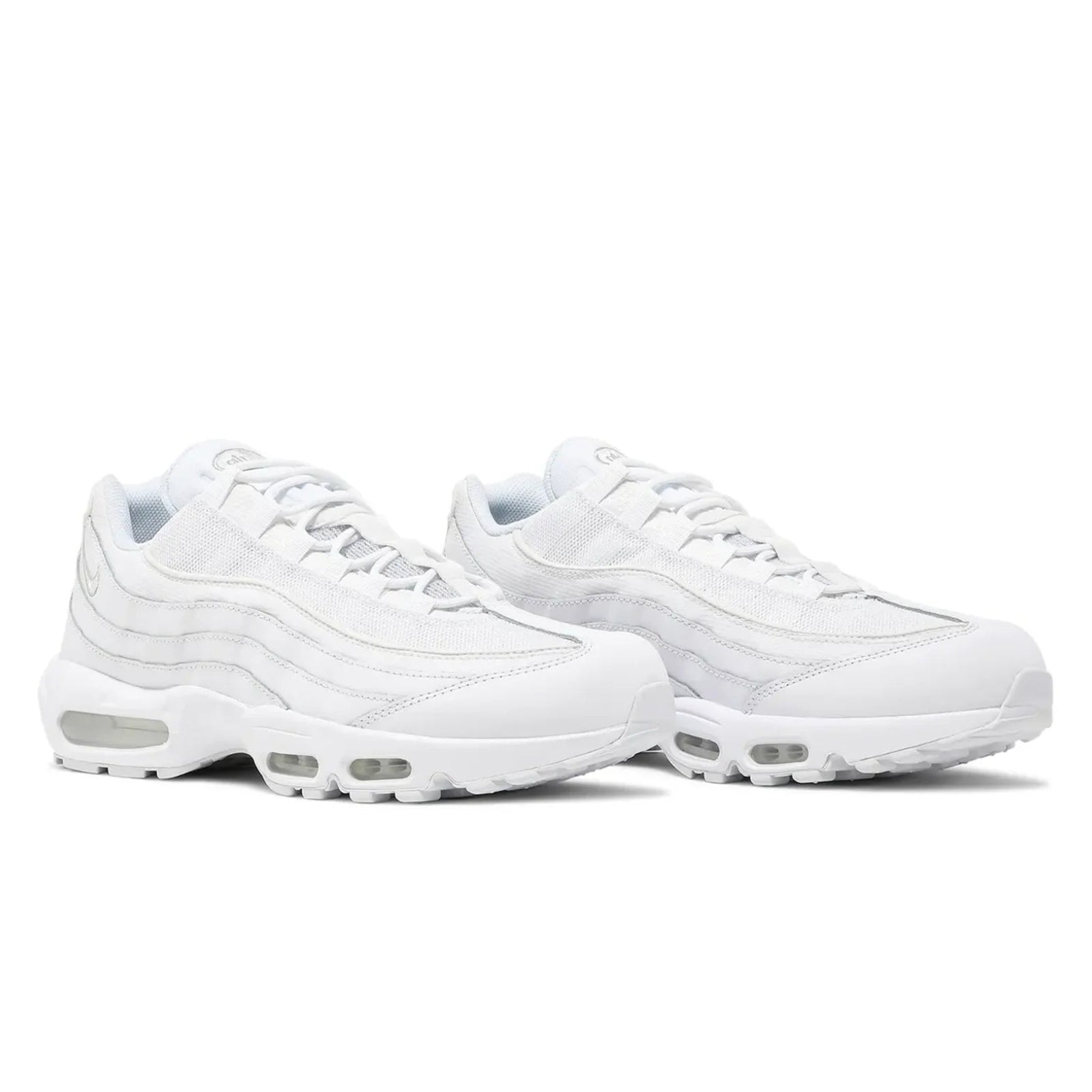 Pair of white sneakers on a white background