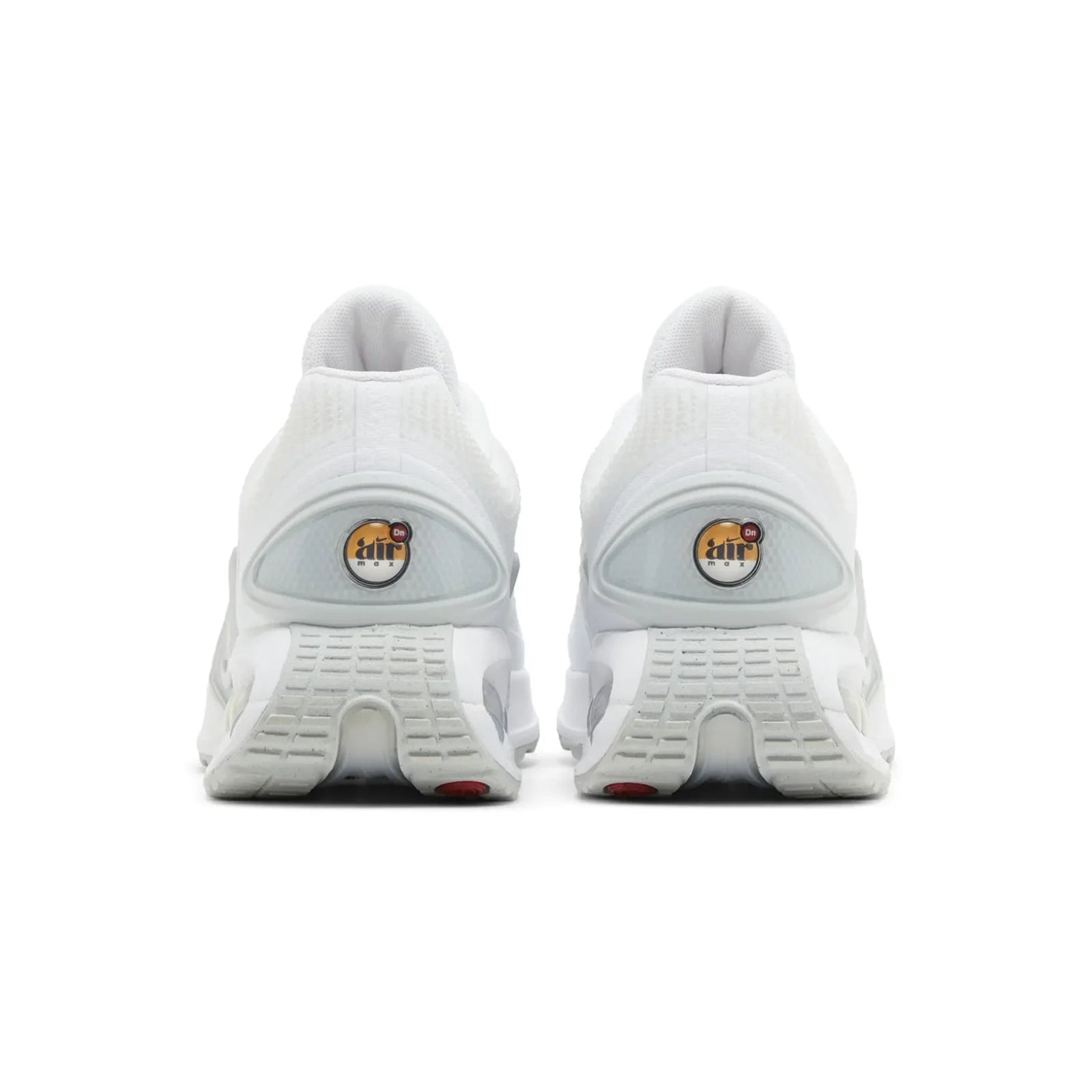 White athletic shoes with visible brand logo on a white background