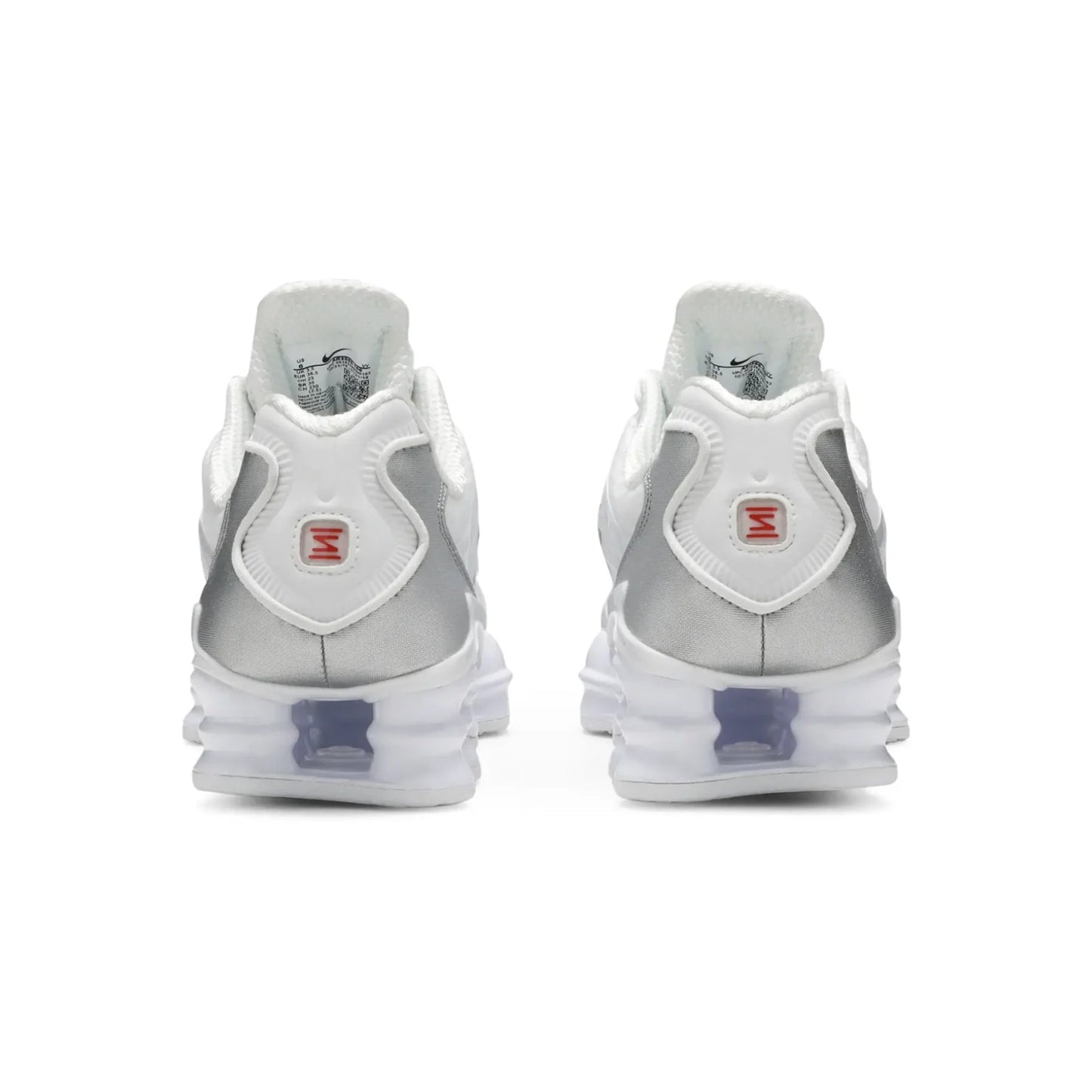 Pair of silver and white sneakers on a white background