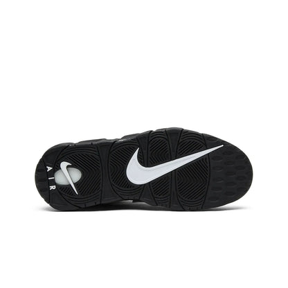 Black Nike sneaker with white swoosh logo on a white background