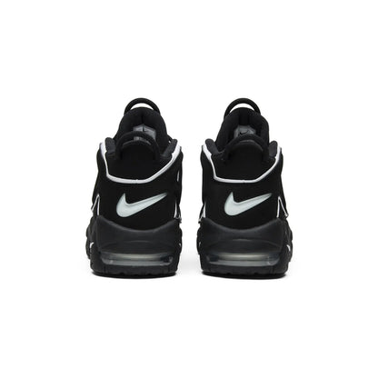 Black sneakers with white Nike logos on a white background